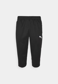 Black athletic pants with an elastic waistband, featuring a white logo on the left leg and a smooth, lightweight fabric.