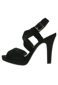 Svart mocka högklackad sandal med plattformssula, med korsade remmar och en ankelrem med detalj i silverfärg.