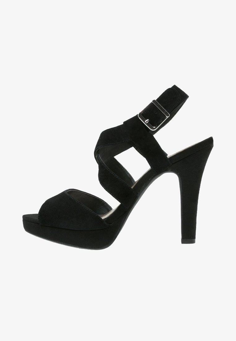 Black suede high-heeled sandal with a platform sole, featuring crisscross straps and an ankle strap with a silver buckle detail.