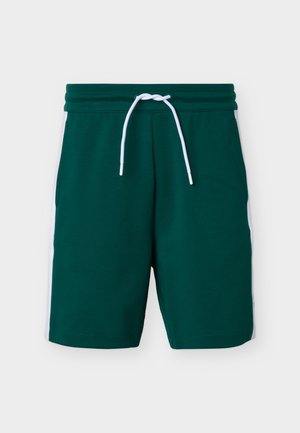 Tumedrohelised sportlikud lühikesed püksid valgete küljeribade ja valge paelaga elastsel vöökohal.