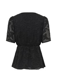 Blouse noire à manches courtes en tissu transparent avec motifs floraux en relief, taille élastique, vue de dos. Personne présente.