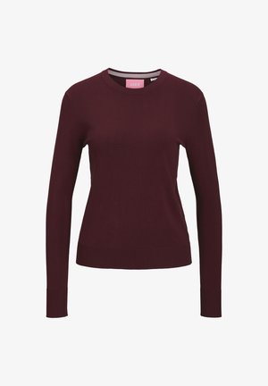 Maglione in bordeaux a maglia con maniche lunghe, scollatura rotonda e polsini e orlo a costine. Tessuto testurizzato con una finitura liscia. Etichetta del marchio visibile all'interno.