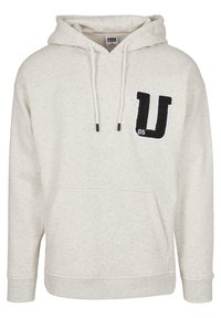 Felpa grigia chiara realizzata in morbido tessuto, con tasca a marsupio, cappuccio con coulisse e logo ricamato nero a forma di "U" con accento "05".