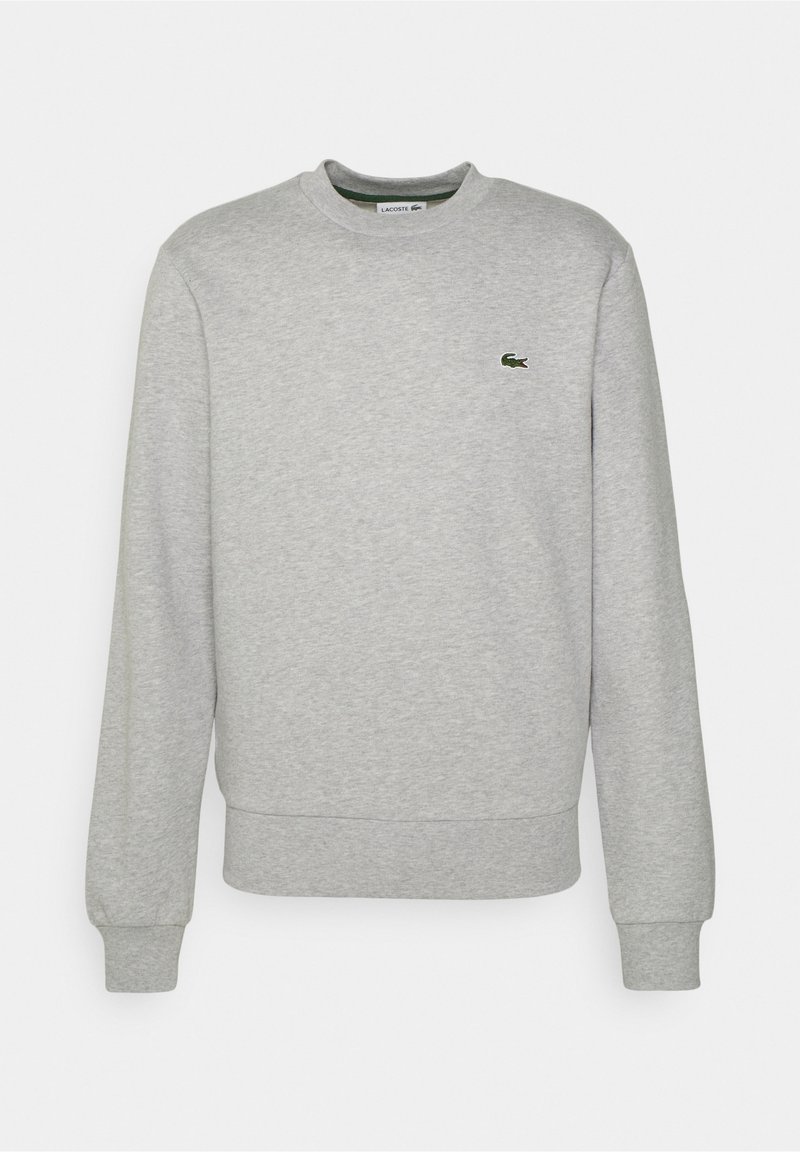 Sweatshirt gris clair à manches longues avec col ras du cou, poignets et ourlet côtelés, arborant un petit logo crocodile vert sur la poitrine.