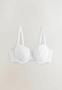 Soutien-gorge blanc rembourré avec armatures et bretelles réglables sur un fond neutre.