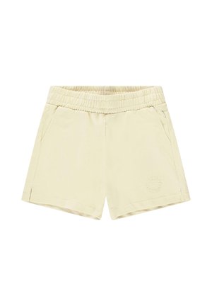 Lichtbeige shorts gemaakt van zachte stof, met een elastische tailleband, twee zijzakken en een reliëf logo detail aan de voorkant.
