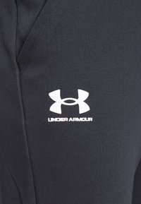Under Armour Teplákové kalhoty - black