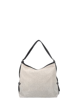 Sac à main beige avec une bandoulière noire, décoré de petites clous argentés, présenté sur un fond blanc uni.