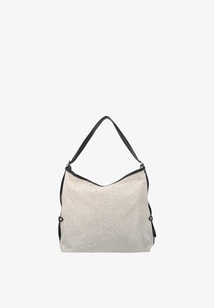 Sac à main beige avec une bandoulière noire, décoré de petites clous argentés, présenté sur un fond blanc uni.