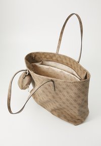Tote bag in brown patterned material with a spacious interior, featuring a zip pocket, two long handles, and a removable coin purse.