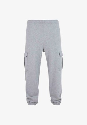 Pantaloni tuta grigi realizzati in tessuto morbido, dotati di due tasche cargo laterali, vita elastica e polsini elasticizzati alle caviglie.