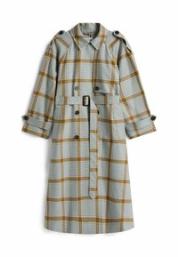 Gabardina larga de cuadros en azul claro y mostaza. Presenta una cintura con cinturón, botones de doble abotonadura y hombreras. Tejido de mezcla de algodón.