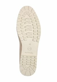 Semelle de chaussure beige avec un motif de bande de roulement profond, taille 37 indiquée, et logo de la marque "Tamaris" gravé sur la semelle.