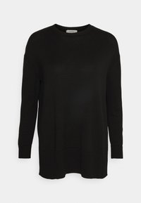 Pull noir en maille à manches longues avec col rond et poignets et ourlet côtelés, posé à plat sur un fond blanc.