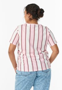 Striped short-sleeve top in light pink and white with narrow burgundy lines. Features a round neckline and relaxed fit.
