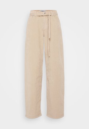 Bežs kordūru platā kāju bikses ar saišu jostu, kas piedāvā teksturētu audumu, divas priekšējās kabatas un brīvu siluetu.