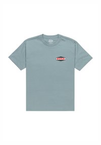 Light blue cotton t-shirt with short sleeves, round neckline, and a red and black RVCA logo patch on the left side.
