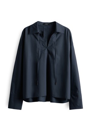 Navyblaue Baumwollbluse mit V-Ausschnitt, langen Ärmeln und lockerer Passform. Mit Kordelzügen am Ausschnitt und einem abgerundeten Saum.