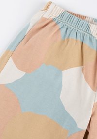 Cotton shorts with an elastic waistband, featuring abstract shapes in pastel colors: blue, peach, cream, and beige with a soft texture.