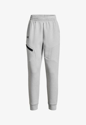 Ljusgrå sweatpants i mjukt tyg med elastisk midja, smala ben och en svart dragkedjeficka på ena sidan.