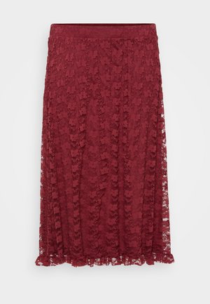 Burgundy lace skirt with floral pattern, semi-sheer fabric, and a ruffled hem. A stretch waistband offers comfort and flexibility.
