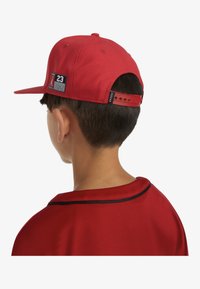 Jordan JAN FLATBRIM UNISEX - Naģene - red