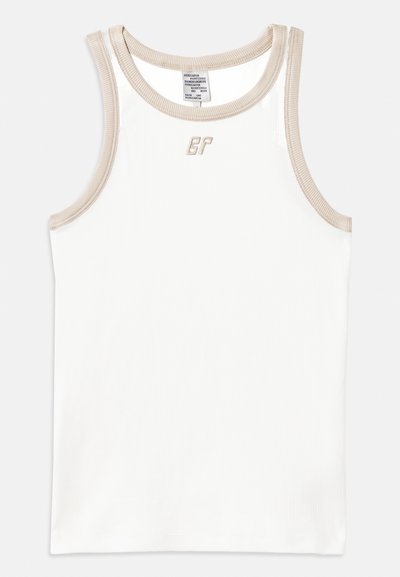 White ribbed tank top with beige trim and a small embroidered logo on the front, featuring a round neckline and sleeveless design.