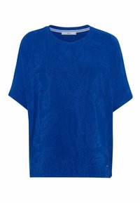 Camiseta de manga corta azul con textura floral, cuello redondo y corte relajado. Elaborada con una tela suave con detalles de patrón sutil.