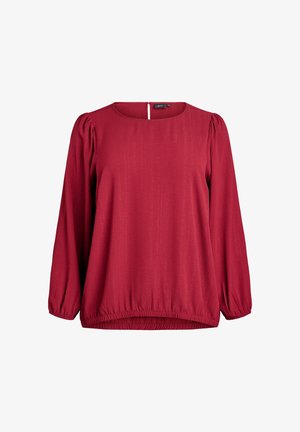 Blusa rossa a maniche lunghe con una sottile trama verticale, scollatura rotonda, polsini elasticizzati e orlo arricciato.