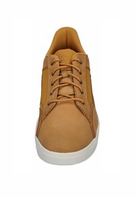 Tan leather sneaker with brown laces, padded collar, and white rubber sole, shown from front view on a white background.