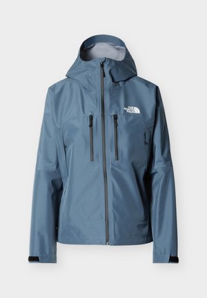 Veste imperméable à capuche bleue avec fermeture éclair frontale, poches zippées sur la poitrine, sangles de poignet en Velcro et logo blanc "The North Face" sur la poitrine.