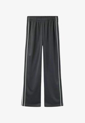 Mustad laiade säärtega püksid, millel on elastne vöökoht ja valged vertikaalsed triibud mööda väliseid õmblusi, laotatud lamades valgel taustal.