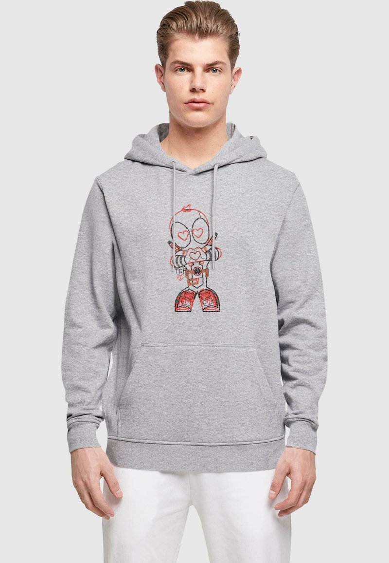 Felpa grigia con tasca a marsupio frontale, caratterizzata da una grafica colorata di un personaggio dei cartoni animati con una macchina fotografica e occhi a forma di cuore.