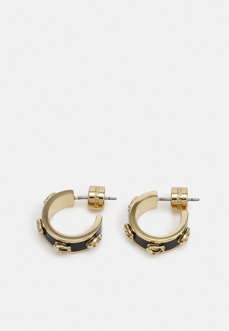 Gold-toned hoop earrings with black accents featuring decorative hardware details and a polished finish, secured with a stud closure.