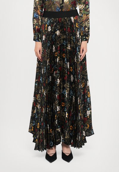 Pleated maxi skirt with a black background, featuring colorful floral patterns. The fabric has a smooth texture and an elastic waistband.