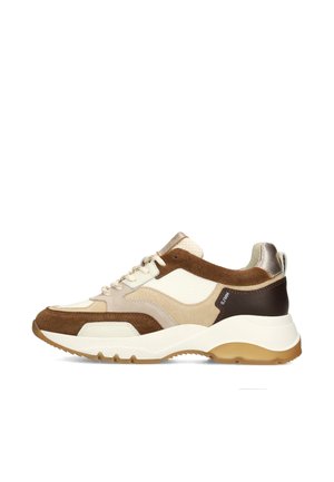 Chunky sneaker with layered beige, brown, and white suede and leather panels, white laces, and a thick textured light brown sole.