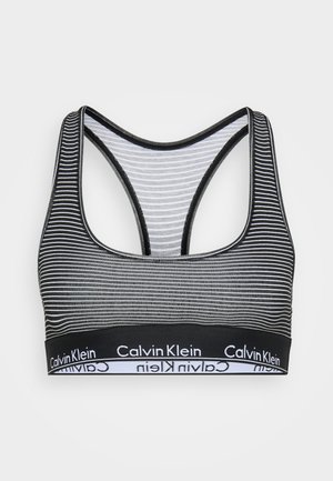 Fekete-fehér csíkos bralette racerback kialakítással és rugalmas pánttal, amelyen a Calvin Klein logó található. Puha anyagból készült, jól illeszkedő fazon.