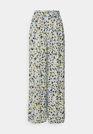 Wide-leg trousers in light blue fabric, featuring a leopard print pattern in black, yellow, and dark brown. Elastic waistband and drawstring detail.