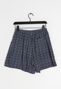Shorts à motifs bleu marine avec une taille élastique. Présente un design floral dans des teintes de rouge et de blanc. Tissu doux et léger.