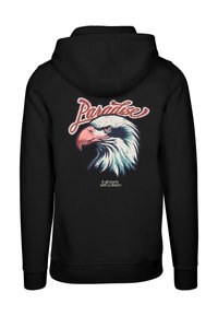 Felpa nera con cappuccio che presenta una grafica di testa d'aquila, con "Paradiso" sopra e "tutto inizia con un sogno" sotto in testo bianco.