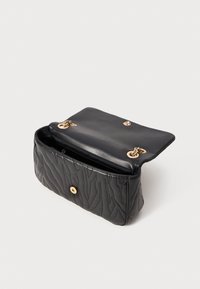 Black quilted leather handbag with gold chain strap and magnetic clasp, shown open against a plain light background.
