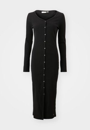 Black long-sleeve dress made of ribbed fabric, featuring a v-neck and front button closure with silver buttons. Accented at the hem.
