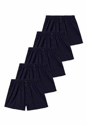 Five pairs of black men's cotton boxers with elastic waistbands and two-button fly closures, arranged in a diagonal line.