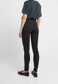 Levi's® Vaqueros pitillo - black denim