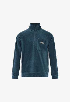 Mørkeblå fleecepullover med halv lynlås, lange ærmer og en brystlomme med et lille logo. Blød tekstur og afslappet pasform.