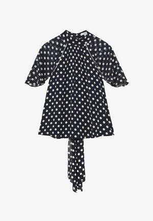 Rochie albastru marin cu buline albe, mâneci transparente până la cot, decolteu înalt și un cordon lung din material care atârnă în spate.