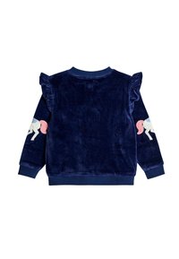 Sudadera de terciopelo azul marino con acentos de hombros con volantes. Presenta bordado de unicornio en las mangas. Los puños y el escote de canalé completan el diseño.