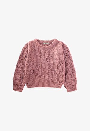 Rožinis megztinis su ribatuoti tekstūra, kuriame yra laisvi dygsniai ir apvali kaklo linija. Rankovės šiek tiek pūstos su tvirtai prisitvirtinusiu rankogaliu.