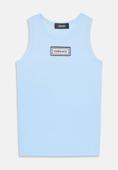 Light blue ribbed tank top with a rounded neckline. Features a rectangular black and white Versace logo patch on the front.