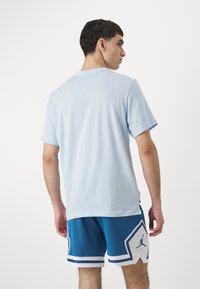 Jordan TOP - Sports T-shirts - celestine blue/black